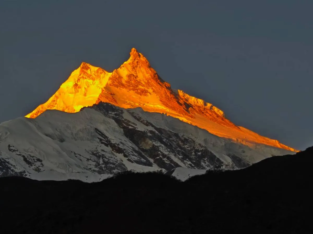 Beautiful sunrise over manaslu peak seen from larke pass