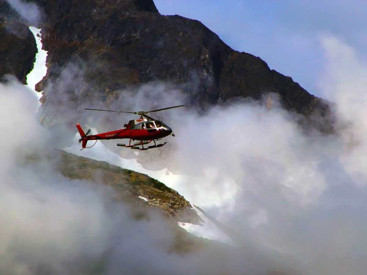 Helicopter flying over Kyanjin Ri Clouds