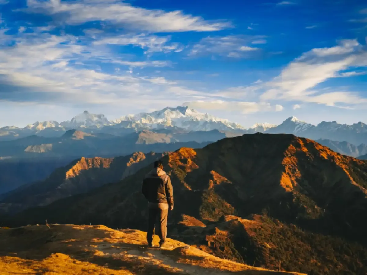 Man clicking in front of high altitude