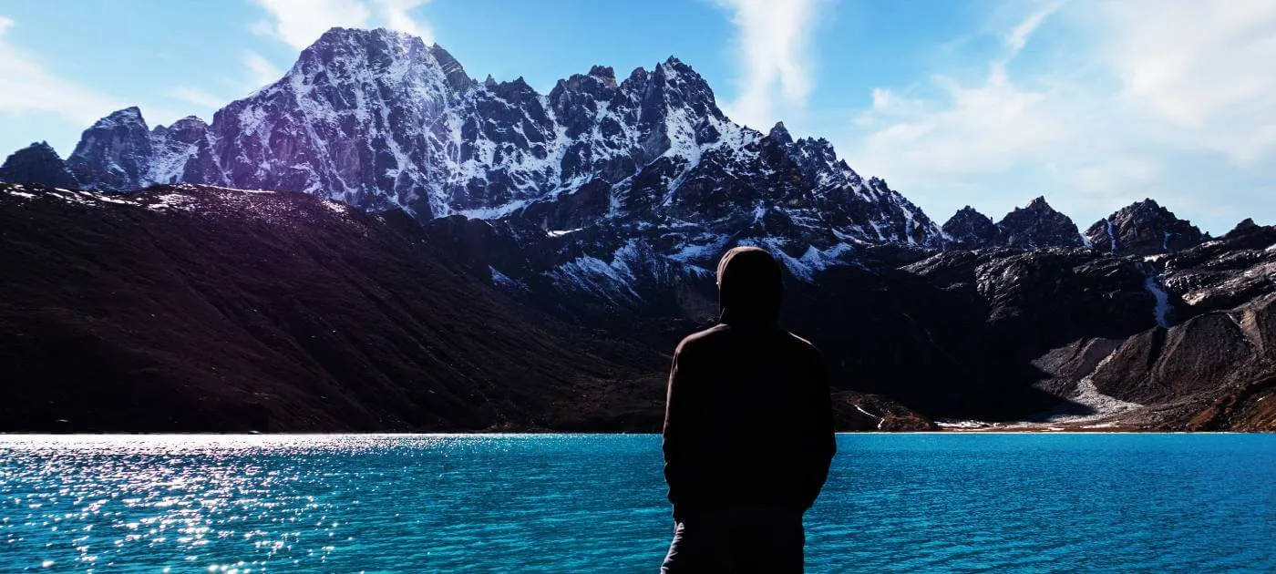 Man standing in front of Gokyo Lake