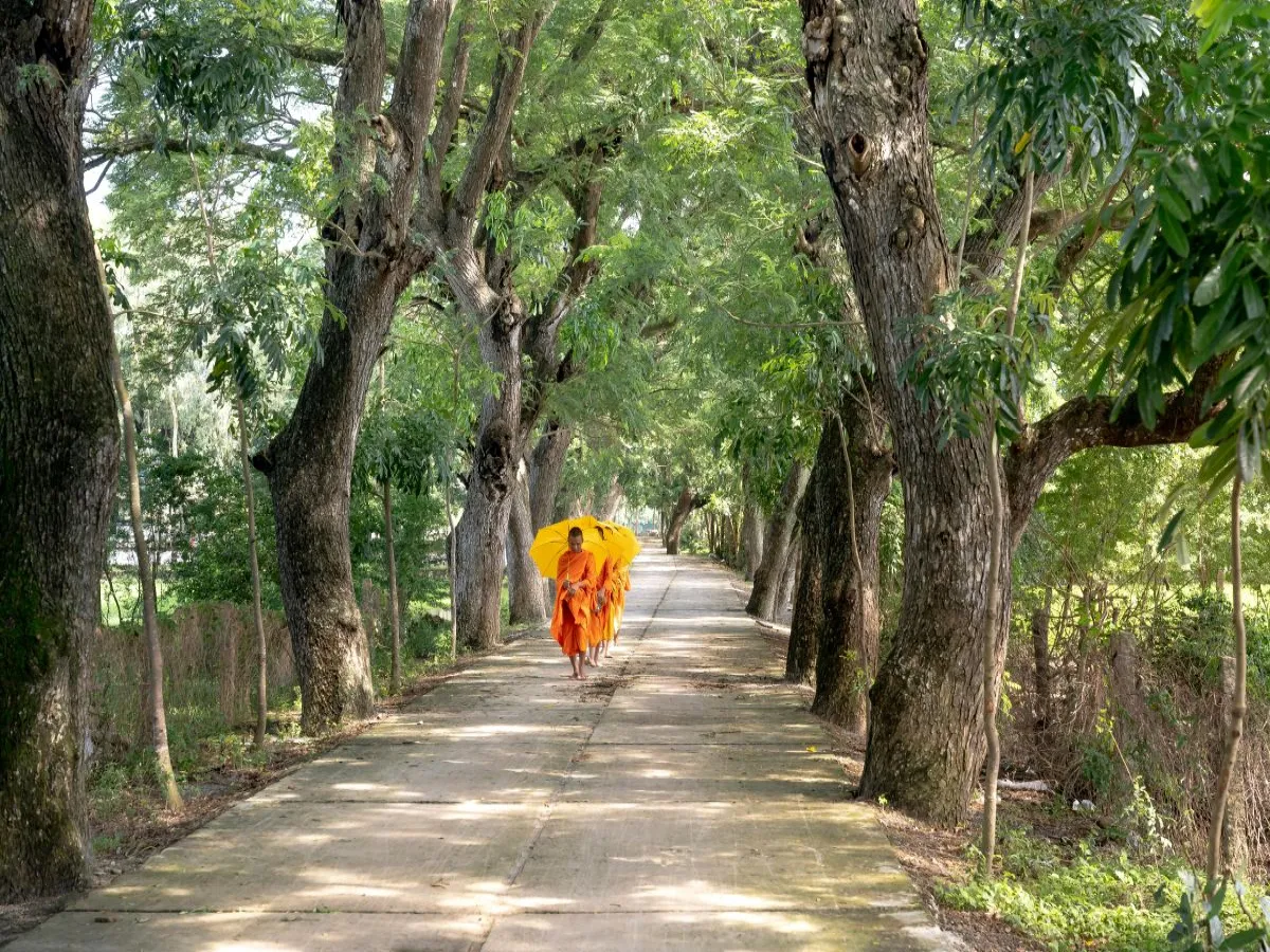 Monks walking in garden of Lumbini