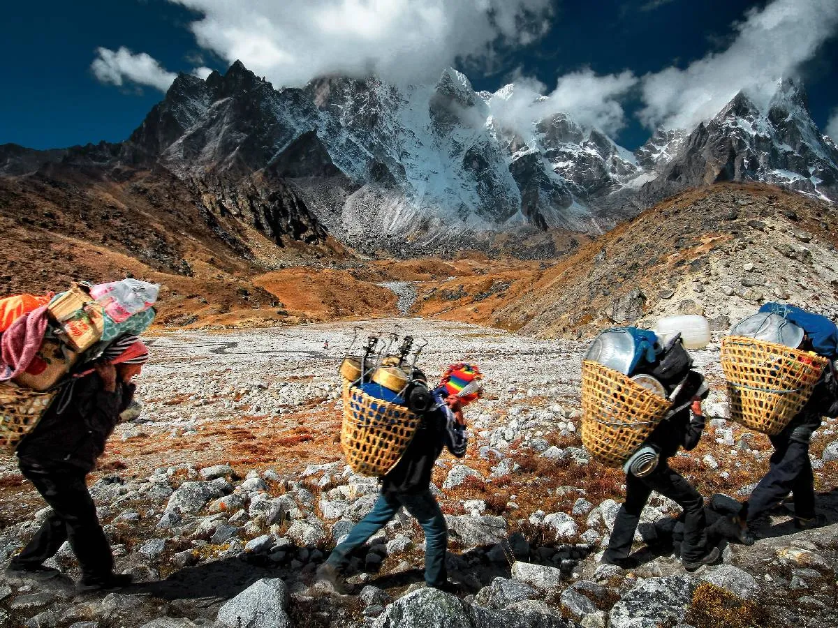 Porter walking in Kanchenjunga