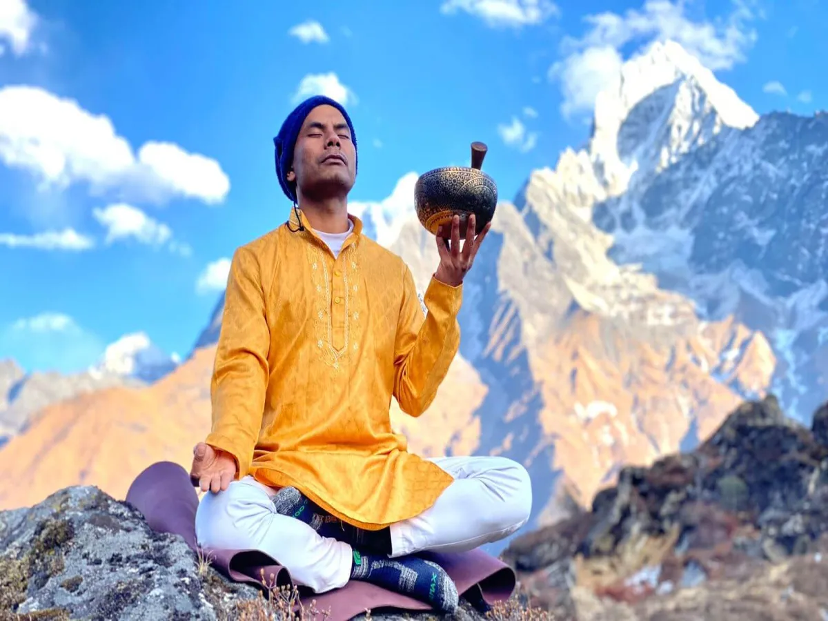 Yoga guru holding bowl for sound healing