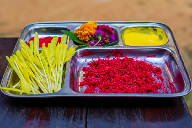 Dashain Tika preparation with yogurt, rice, and vermillion on a ceremonial plate for the Nepali festival.