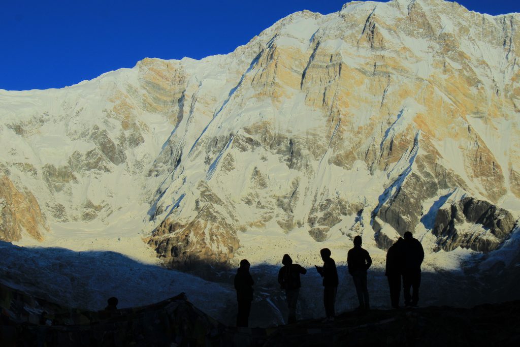 Trekkers getting ready to witness the sunrise at Annapurna ranges