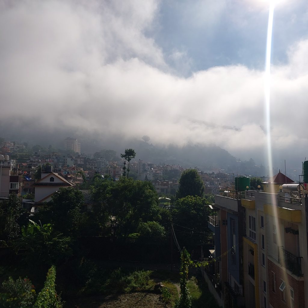Shivapuri Peak draped in a mystical blanket of monsoon clouds, where the heavens meet the earth in serene harmony.