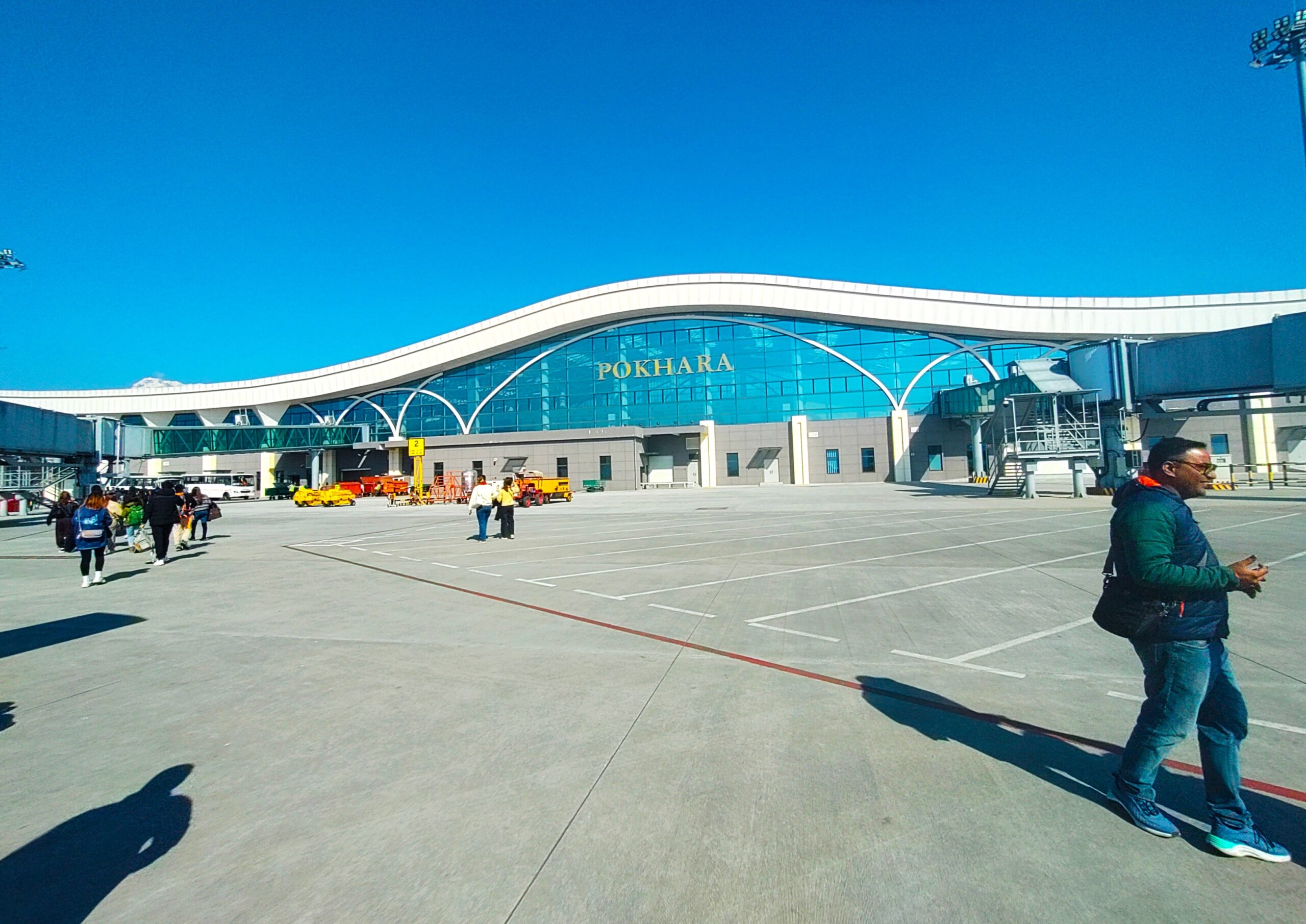 Pokhara International Airport, a key hub for helicopter tourism in Nepal, with mountain views in the background.