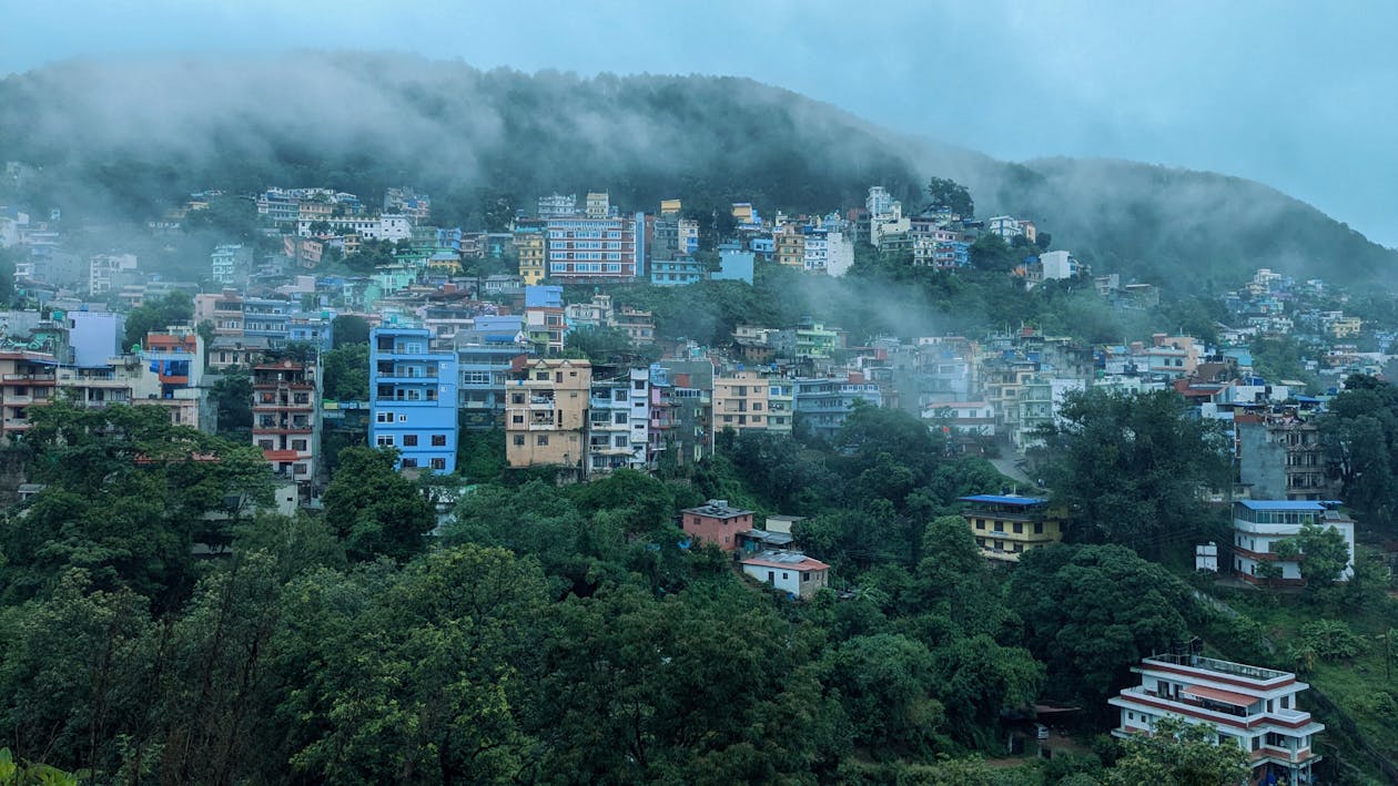 Lush green Palpa Hills shrouded in fog during the rainy season.