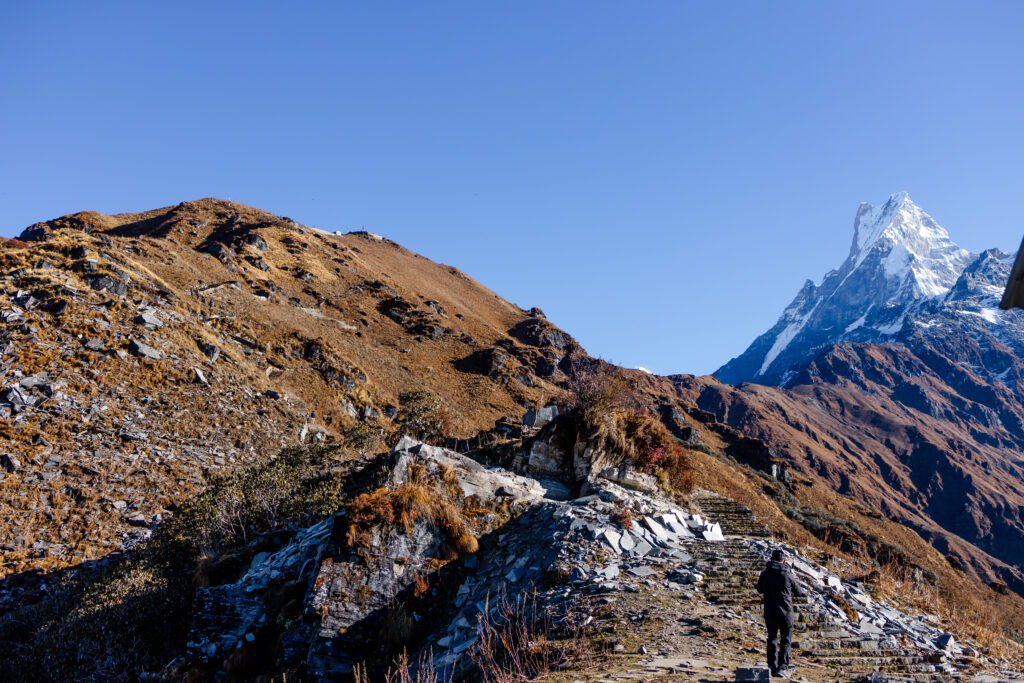 Stunning view of the Machapuchare mountain ranges and winding trekking trails – a breathtaking journey awaits in the heart of the Himalayas.