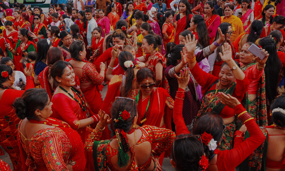 Grace and tradition in every step! A woman beautifully dressed in red celebrating the vibrant festival of Teej. 