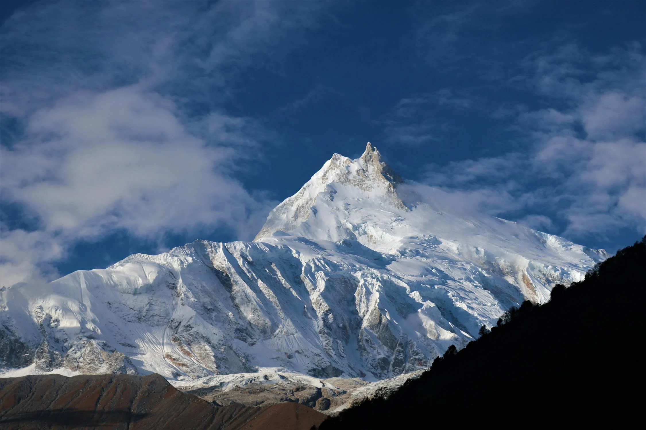 Majestic views of the Manaslu peaks glowing under the Himalayan sky — a serene spectacle for every mountain lover.