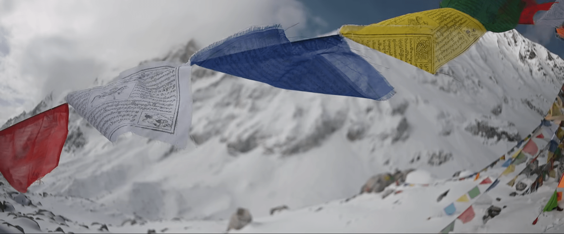 Prayer flags dancing in the mountain breeze — carrying hopes and blessings across the Himalayan sky.