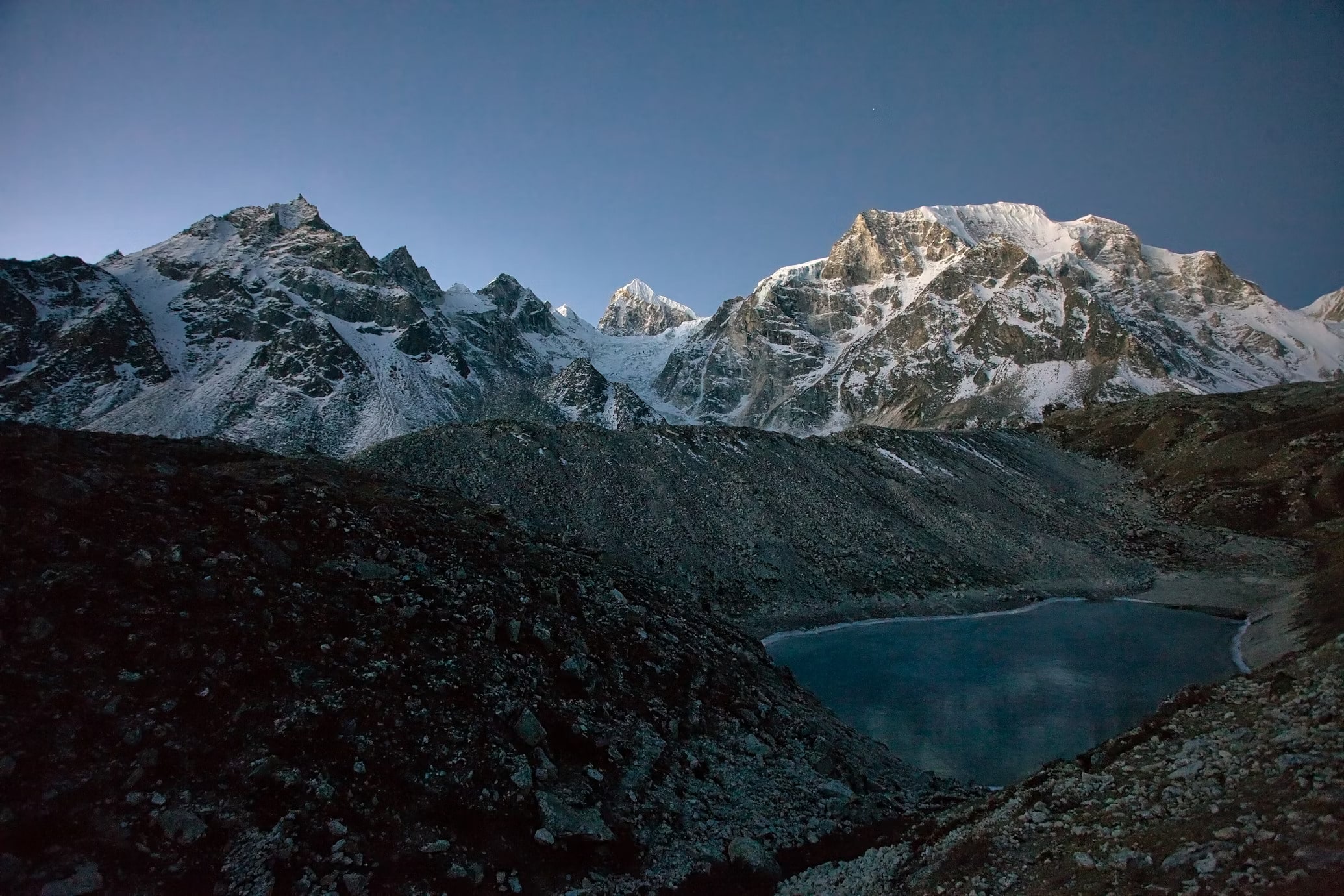 A tranquil moment at Birendra Lake, a glacial gem nestled beneath Mount Manaslu—just an hour's hike from Samagaun.