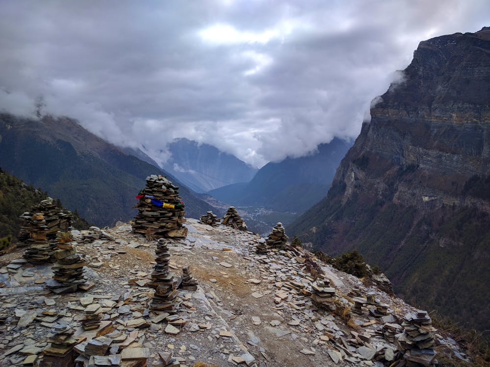 Tibetan-style stones with inscriptions, placed along the trail in the Manaslu region.
