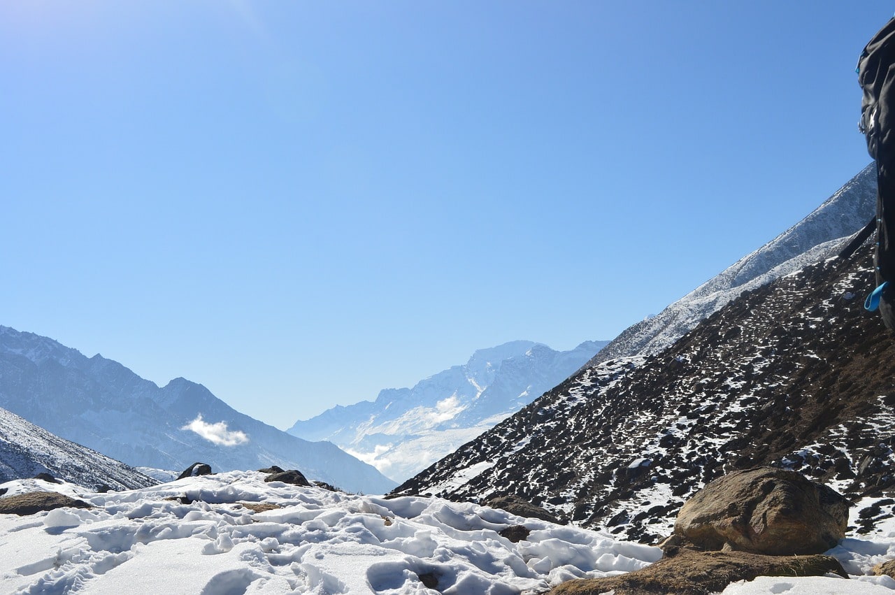 Snow-covered trail on the Manaslu Circuit Trek in February, surrounded by pristine Himalayan landscapes.