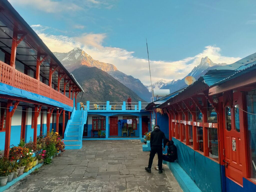Cozy teahouse with Machapuchare (Fishtail) mountain in the background along the ABC trek route.