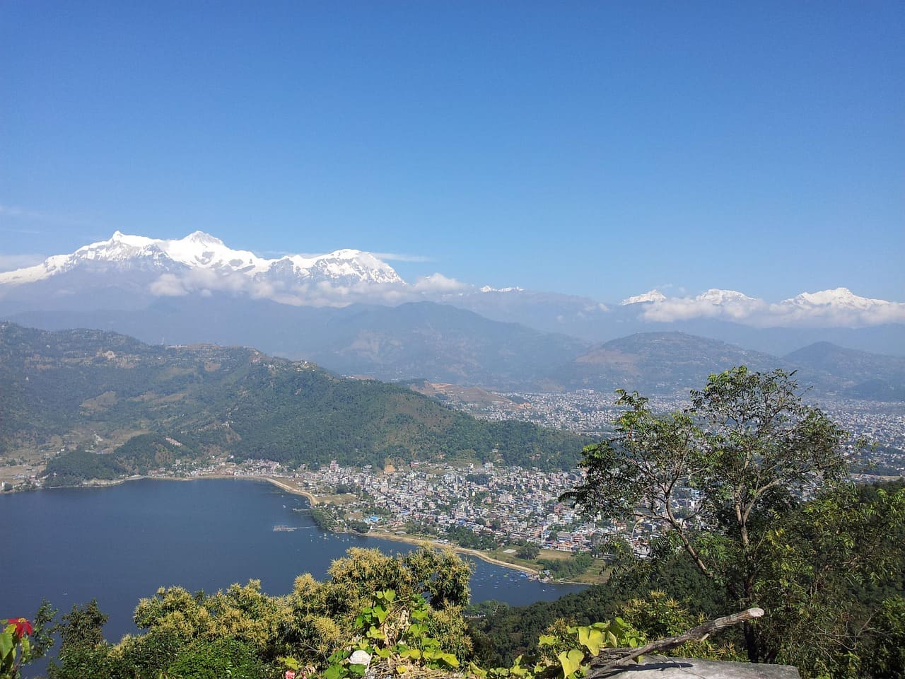 Phewa Lake and Pokhara city with mountain ranges in the background, a top honeymoon destination in Nepal