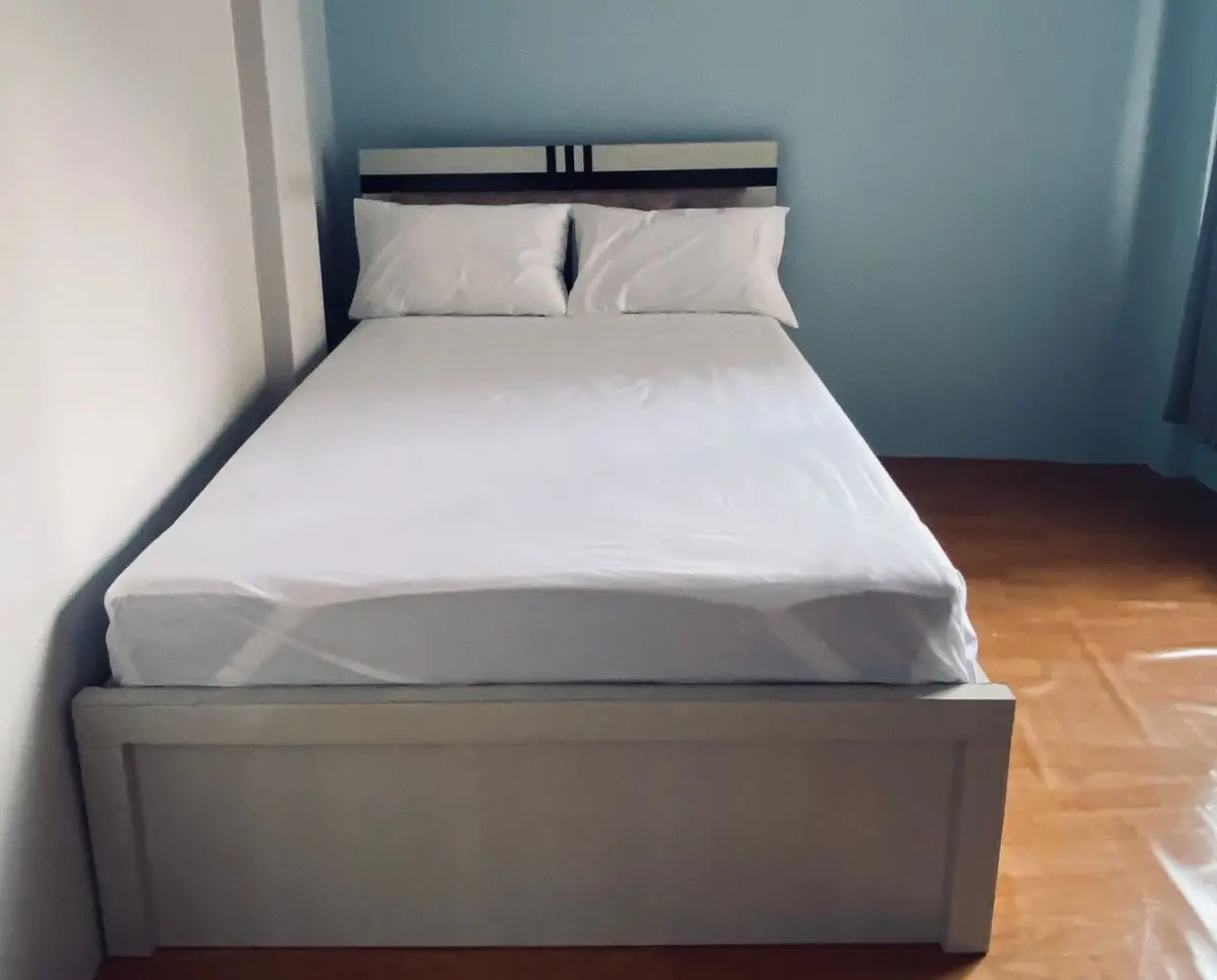 Cozy twin-sharing bed setup in a teahouse during the Annapurna Circuit trek, with warm blankets and pillows