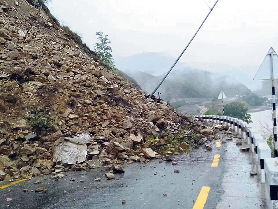 Landslide blocking BP Highway in Sindhuli, Nepal, with mud and rocks on the road causing travel disruption.