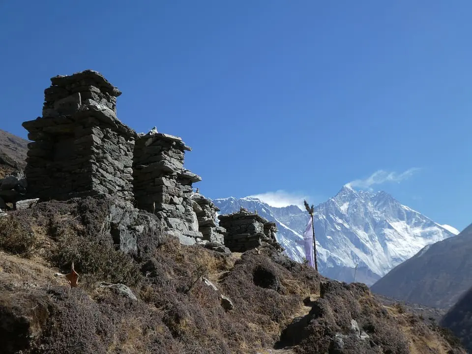 Ancient prayers etched in stone Tibetan mani stones line the paths of the Everest trek, offering blessings to all travelers.