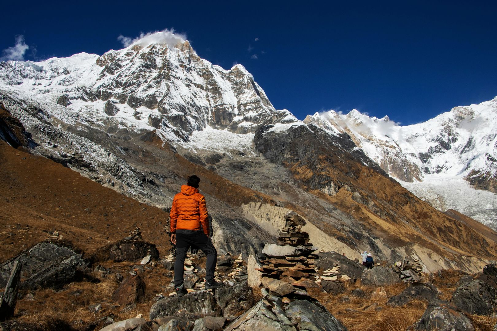 Trekker standing infront of Annapurna base camp