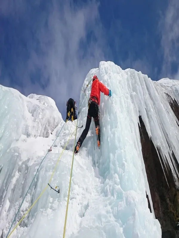 Climber ascending the ice terrain during the Lobuche peak climbing