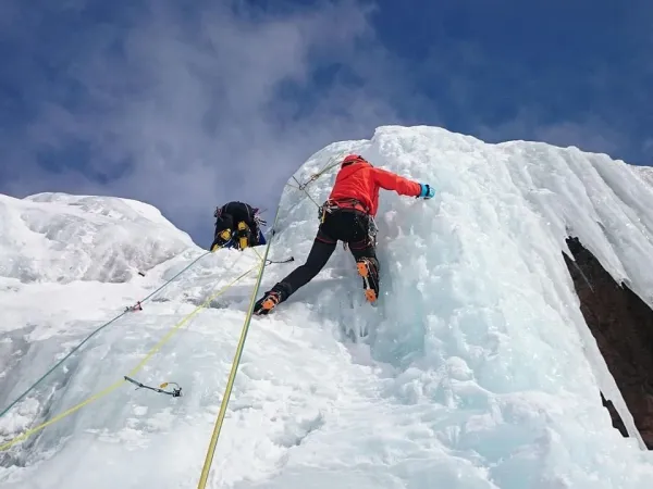 Climber Crossing The Ice Terrain During The Lobuche Peak Climbing