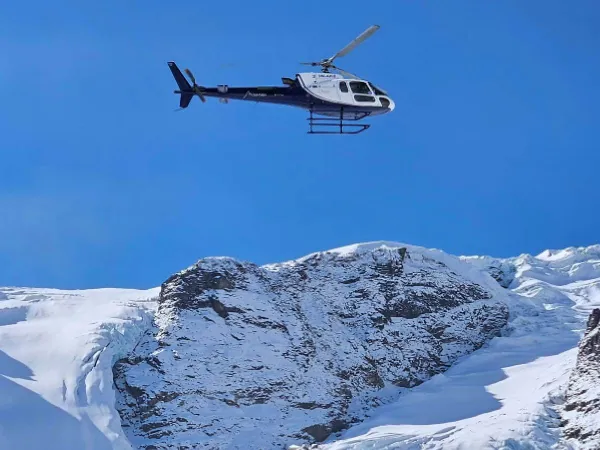 Heli Flying Over Mountains