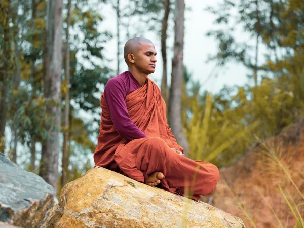 Monk Doing Yoga In Peaceful Place Away From The City