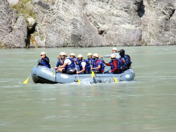 People Having Their Time In River Rafting