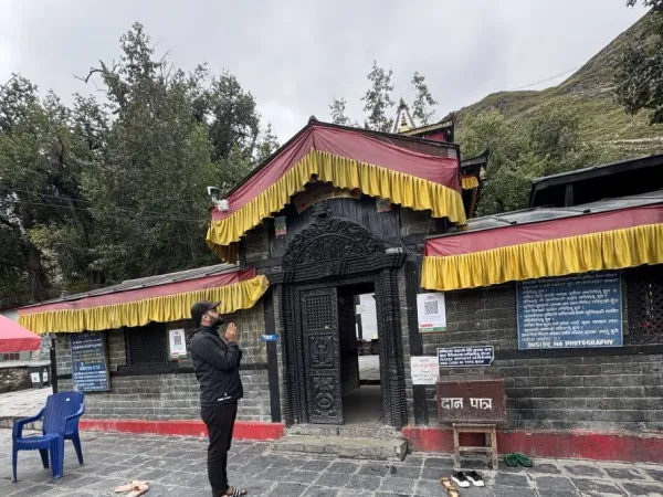Person Praying To Muktinath Temple
