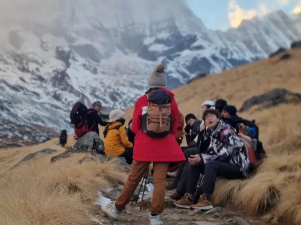 Trekkers Sitting On The Way To Annapurna