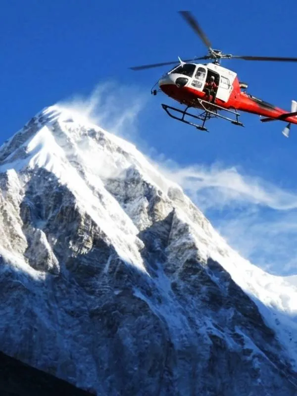Helicopter flying over Everest peak