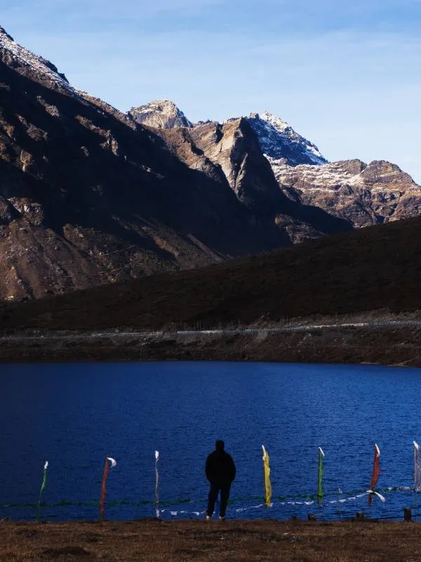 Man standing infront of Damodar Kunda